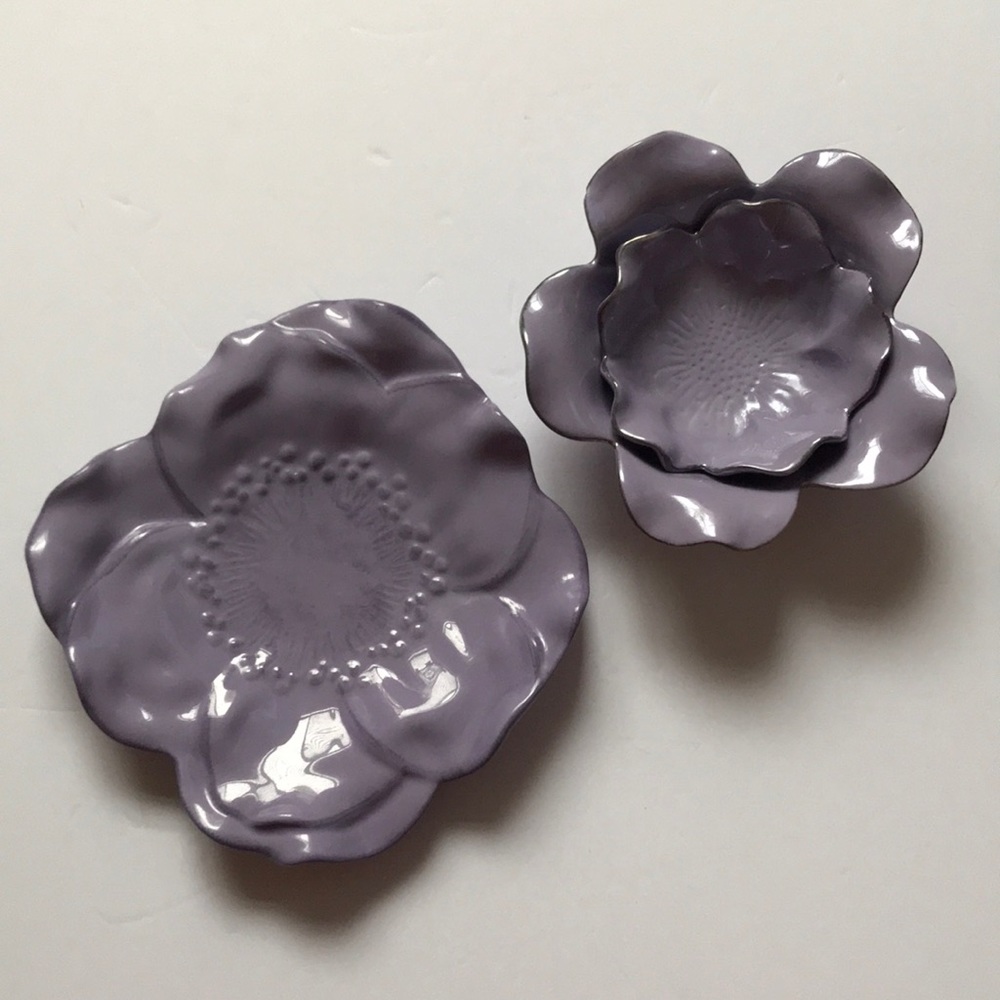 Two purple catch all plates or jewelry holders
